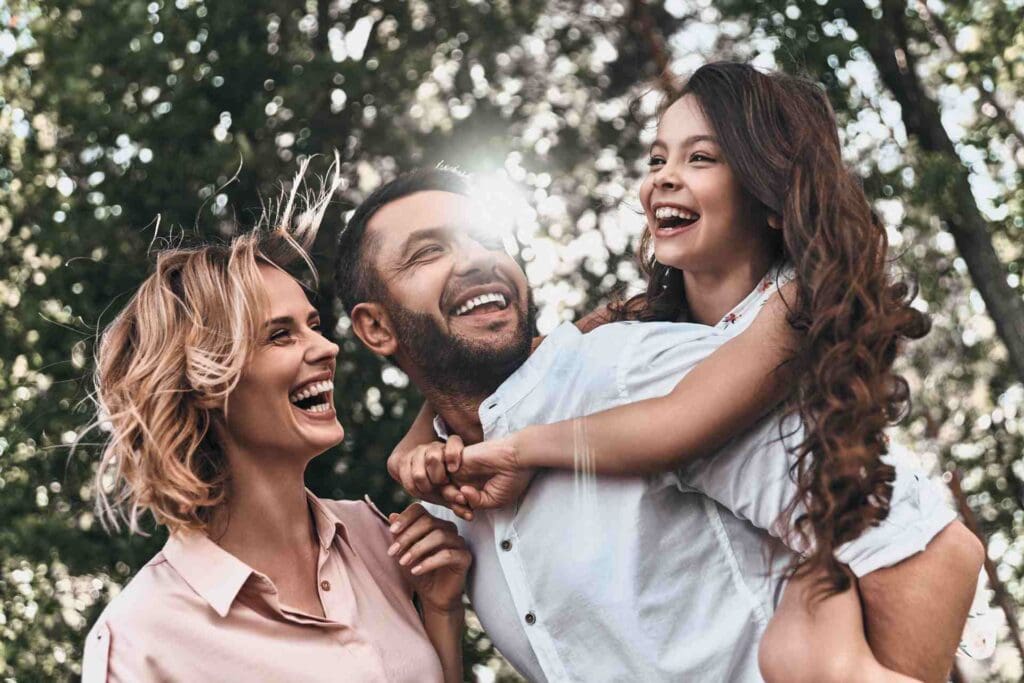 Family Together Smiling and Laughing